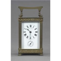 A 19th century French brass cased carriage clock, with alarm the white enamelled dial with Roman...