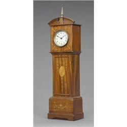 A mahogany timepiece, as a miniature longcase clock, the circular dial with Arabic chapter ring i...