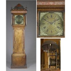 An oak longcase clock, the square 30.5cm brass dial with mask and scroll spandrels, Roman and Ara...