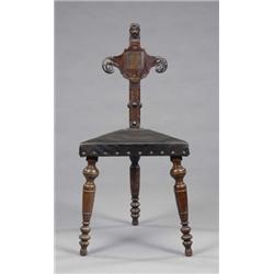 A curious 19th century oak triangular hall seat, in Renaissance style, the chamfered 'post' back...