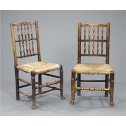 A harlequin set of six rush seat elm Lancashire spindle back dining chairs, (one 20th century); a...