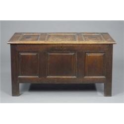 An early 18th century oak blanket chest, the front with three rectangular raised-and-fielded pane...