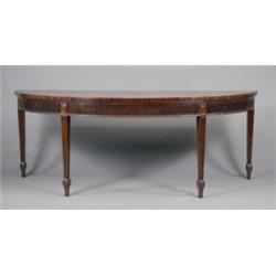 A fine large George III mahogany semi-elliptical side table, the top with matched veneers, broad...