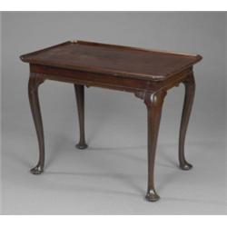 A George II mahogany silver table, the rectangular top with raised moulded re-entrant borders, ca...