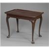 Image 1 : A George II mahogany silver table, the rectangular top with raised moulded re-entrant borders, ca...