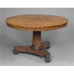 A William IV mahogany circular dining table, with shallow moulded frieze and tilting on a plain c...