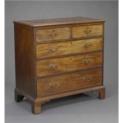 A George III mahogany chest, the crossbanded moulded top above two short and three long cockbeade...