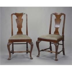 A set of six Edwardian mahogany dining chairs, in George I style, the shaped arched backs with le...