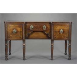 A post-Regency mahogany breakfront sideboard, of good colour, fitted to the centre with a drawer...