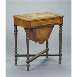 A Victorian walnut rounded rectangular worktable, fitted with a shallow drawer and sliding needle...
