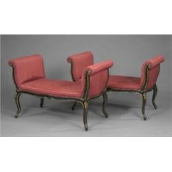 A pair of 19th century parcel gilt and ebonised window seats, of slender rococo form, the tall sc...