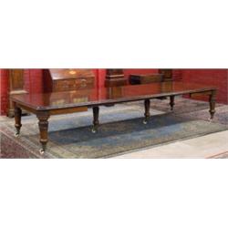 A very fine large William IV mahogany extending dining table, the moulded rounded rectangular top...