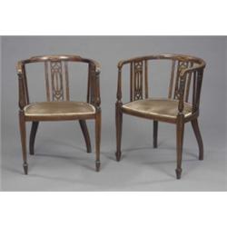 A pair of Edwardian mahogany semi-circular elbow chairs, with pierced interlaced splats and inlai...