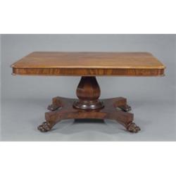 A substantial William IV mahogany dining table, the ovolo moulded rounded rectangular top above a...