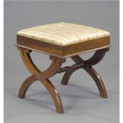 An early Victorian rosewood lotus carved X-frame stool, with slip-on seat, turned stretcher and b...