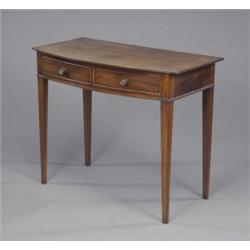 A George III mahogany bow-front side table, the reeded top above two shallow cockbeaded drawers w...