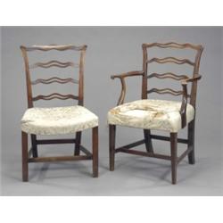 A George III mahogany elbow chair, with shaped pierced ladder back and outscrolled arms, stuffed-...