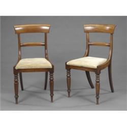 A set of six William IV mahogany dining chairs, with curved oversailing cresting rails and plain...