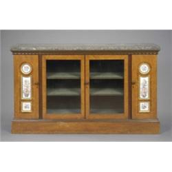 A 19th century French porcelain mounted thuya side cabinet, the variegated rose and black marble...