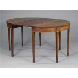 A George III mahogany dining table, the semi-circular ends on square tapering legs and spade feet...