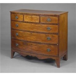 A Regency mahogany bow-front chest, fitted three short cockbeaded drawers above three long drawer...