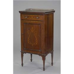 A late Victorian mahogany Sheraton revival music cabinet, with brass balustraded gallery above a...