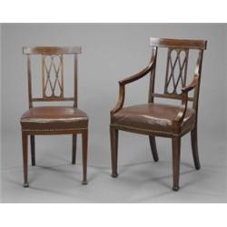 A set of six Edwardian mahogany Sheraton revival dining chairs, with oversailing cresting rails,...