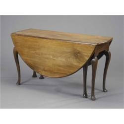 A George II mahogany oval pembroke dining table, the cabriole legs on panelled pad feet, 134 x 14...