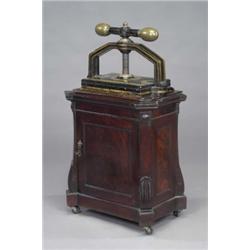 An early Victorian brass mounted black japanned and gilt bookpress, plate 38.1 x 25.4cm, on a mah...
