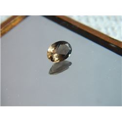 GEMSTONE - SMOKIE TOPAZ - OVAL FACETED - 6.9 X 5.0 X 2.9mm