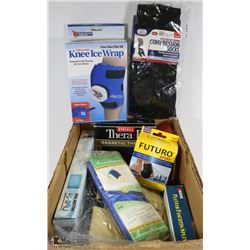 BOX W/ COMPRESSION SOCKS, KNEE WRAPS, AND MORE.
