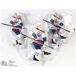 LOT OF 3 CONNOR MCDAVID FIGURES ON STANDS.