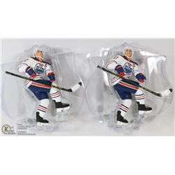 LOT OF 2 CONNOR MCDAVID FIGURES ON STANDS.