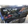 Image 3 : TWO SKYLINE RADIO CONTROLLED HELICOPTERS AND ROCKET MODEL