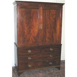 Early C19th mahogany linen press with moulded cornice above 2 panelled doors...
