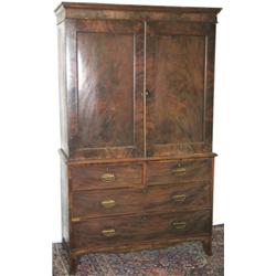 Early C19th mahogany linen press with moulded cornice above 2 panelled doors...