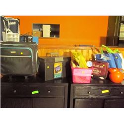 Misc office supplies and luggage. First aid kit and table numbers