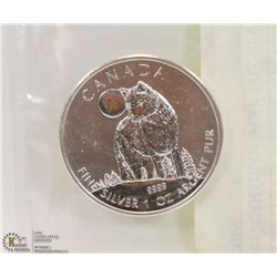 2011 CANADIAN WOLF 1 OZ SILVER COIN.
