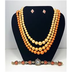 17 - TRIPLE STRAND PEACH PEARL SET