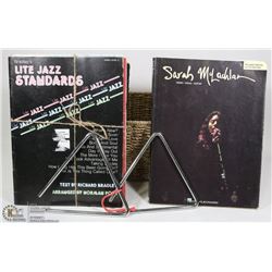 PAIR OF MUSICAL TRIANGLE INSTRUMENTS WITH MUSIC