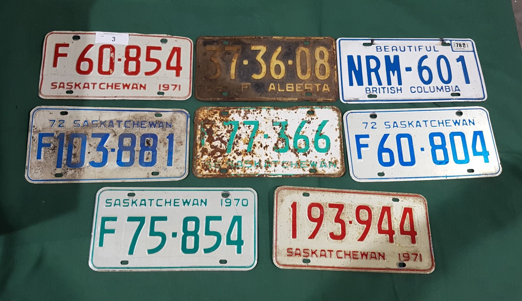 EIGHT VINTAGE LICENSE PLATES
