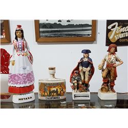 FOUR VINTAGE FIGURAL LIQUOR DECANTERS