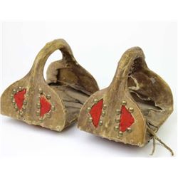 Pair rawhide wrapped Crow stirrups over wood