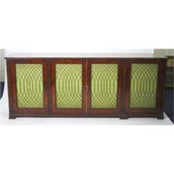 Regency mahogany side cabinet with beaded moulding, the four metal panelled doors with green cloth b