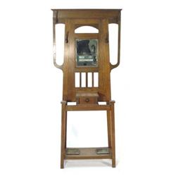 Oak Arts and Crafts hallstand with bevel edged inset mirror, a glove drawer and metal drip trays