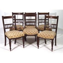 Set of six Edwardian walnut upholstered dining chairs with fluted legs and turned backs