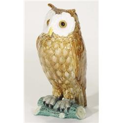 Continental Majolica owl on a branch with beaded glass eyes, decorated in browns, yellows, blues and