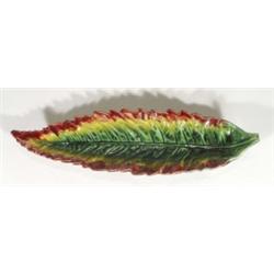 Majolica leaf shaped dish, decorated in green, reds and yellows, 40cm in length