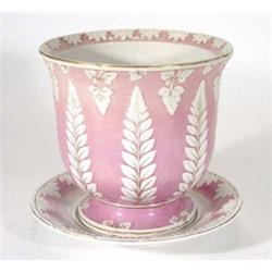 Victorian pottery planter on a stand, relief moulded with leaves onto a pink and gilt ground, lozeng