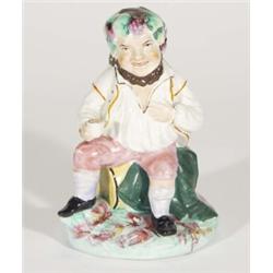 Staffordshire figure of a portly gentleman drinking on a barrel, 19cm high